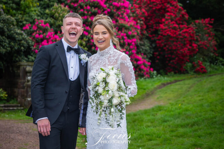 Wortley Hall Wedding Bride and groom smiling in garden setting